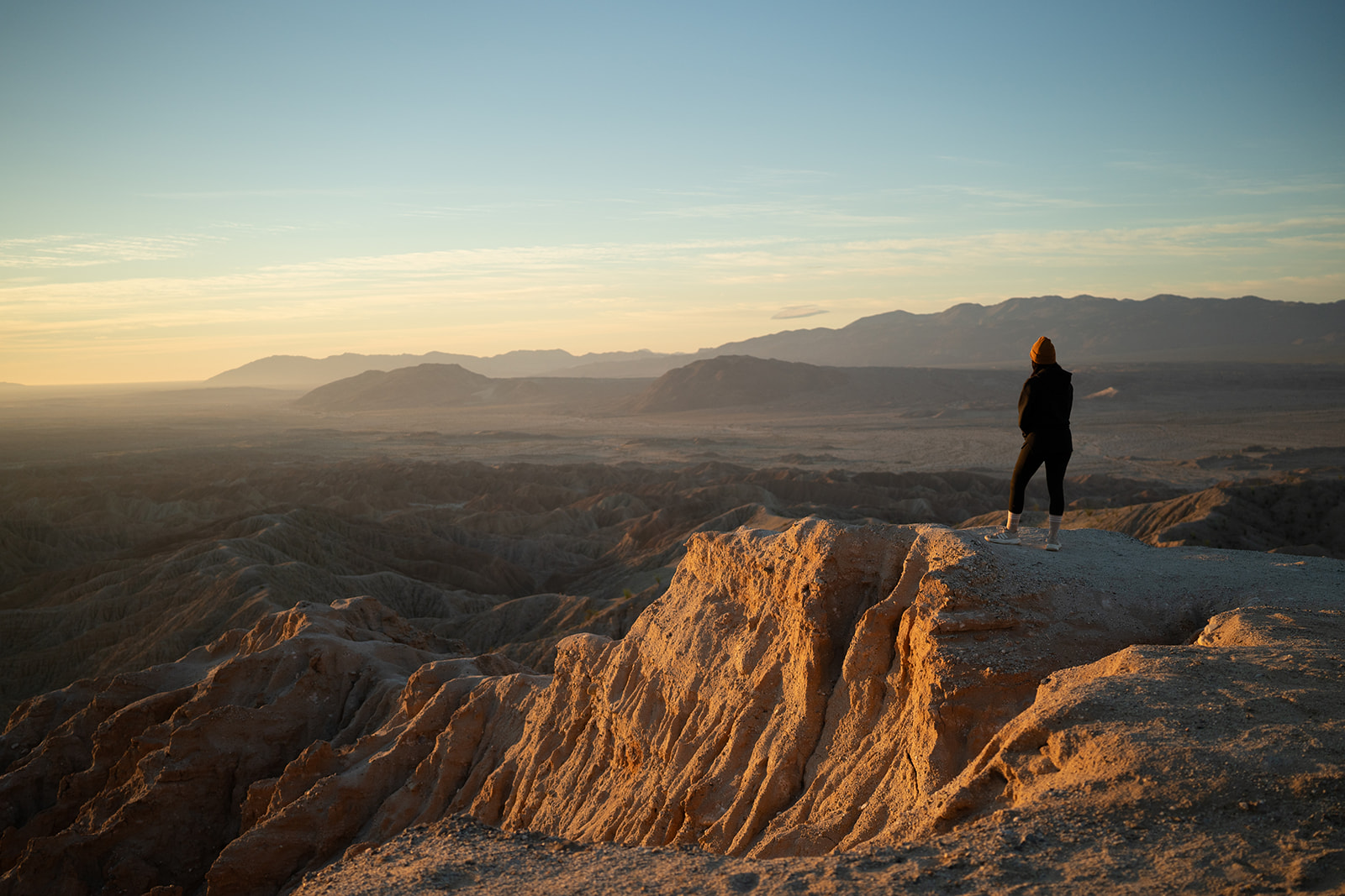 Paola overlooking the desert at sunset